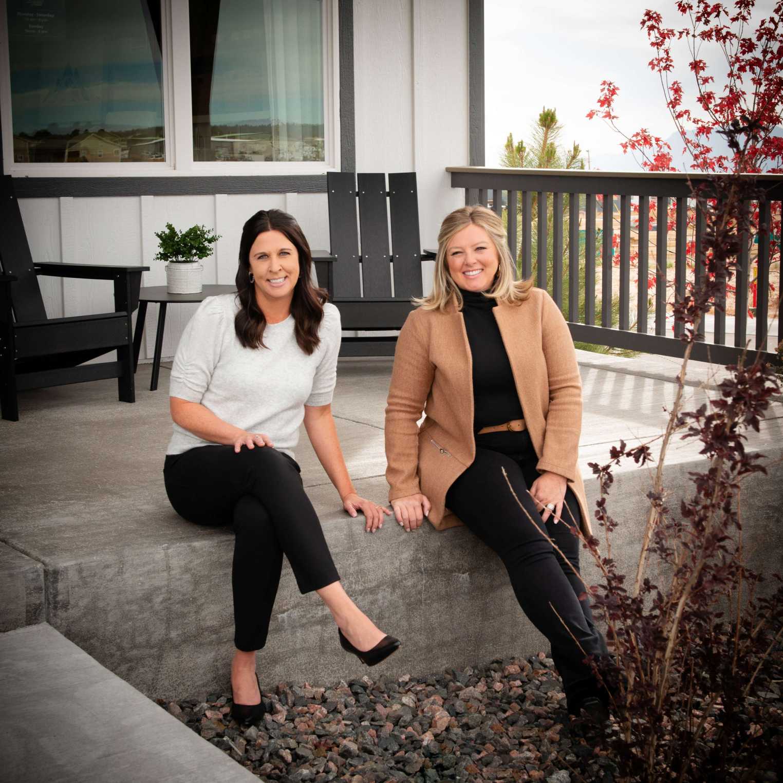 Two women sitting outside
